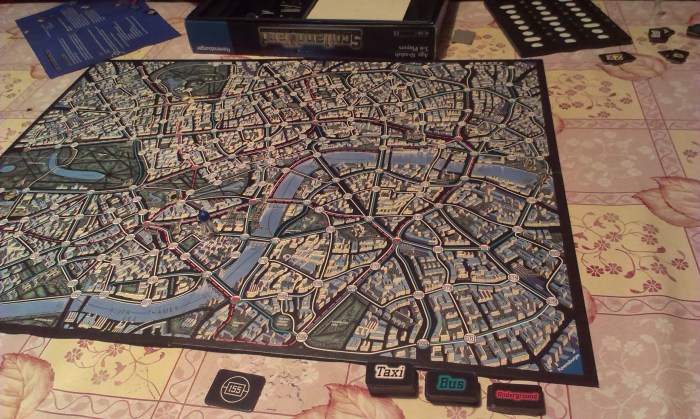 The board, The starting card, my detective and the travel tokens.