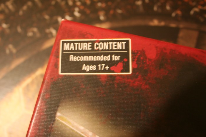 The age rating at the top corner of the box lid.