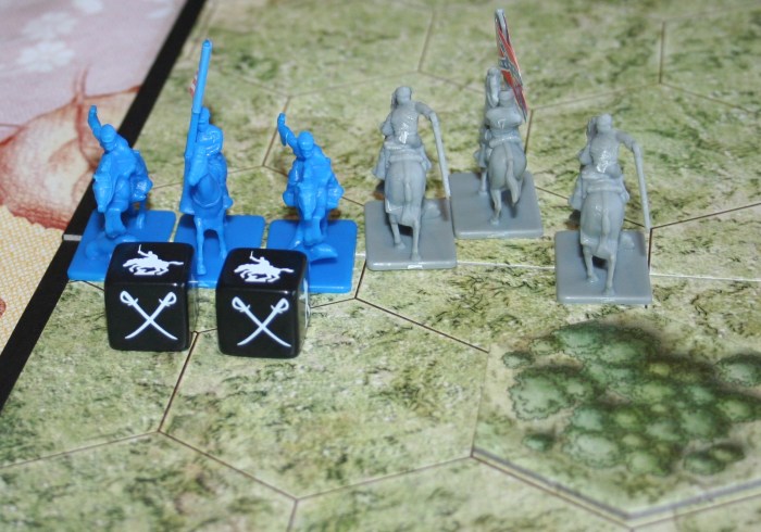 Of the three Battle Dice rolled here two were hits. As you can see, the small image on the dice is of a Cavalry figure. When rolling to eliminate opponents you must roll the correct symbols.